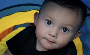 Face of a small child looking up