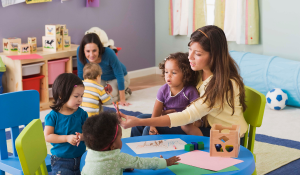 Preschool teachers working with students in a day care or child care facility